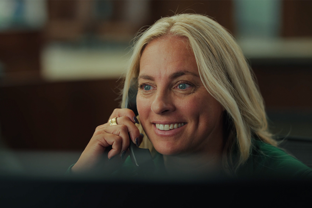 Nicki Collen answers a phone call at Central National Bank